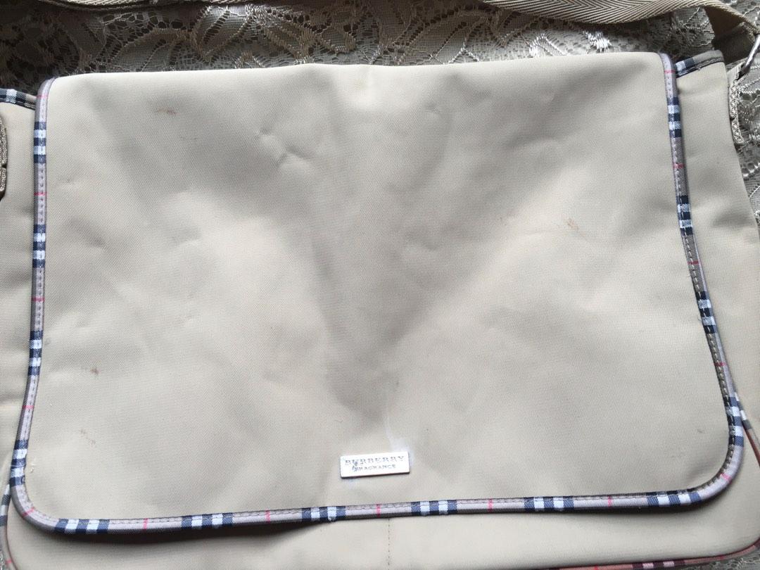 Burberry Fragrance Messenger Bag (Category: Sling Bags) located in Marikina City. Submitted by arrveefm (Listing ID 1189204523, Image 2). Description: Original Burberry Fragrance Messenger Bag Heavily USED, kindly refer to pictures. Fixed Selling Price: Php 850.00 (Shipping NOT YET included; Php 200 via JRS) Visible scratches/minor cuts on fabric, care tag inside heavily scratched, visible ink stains, minor visible rust on all metal due to age; r