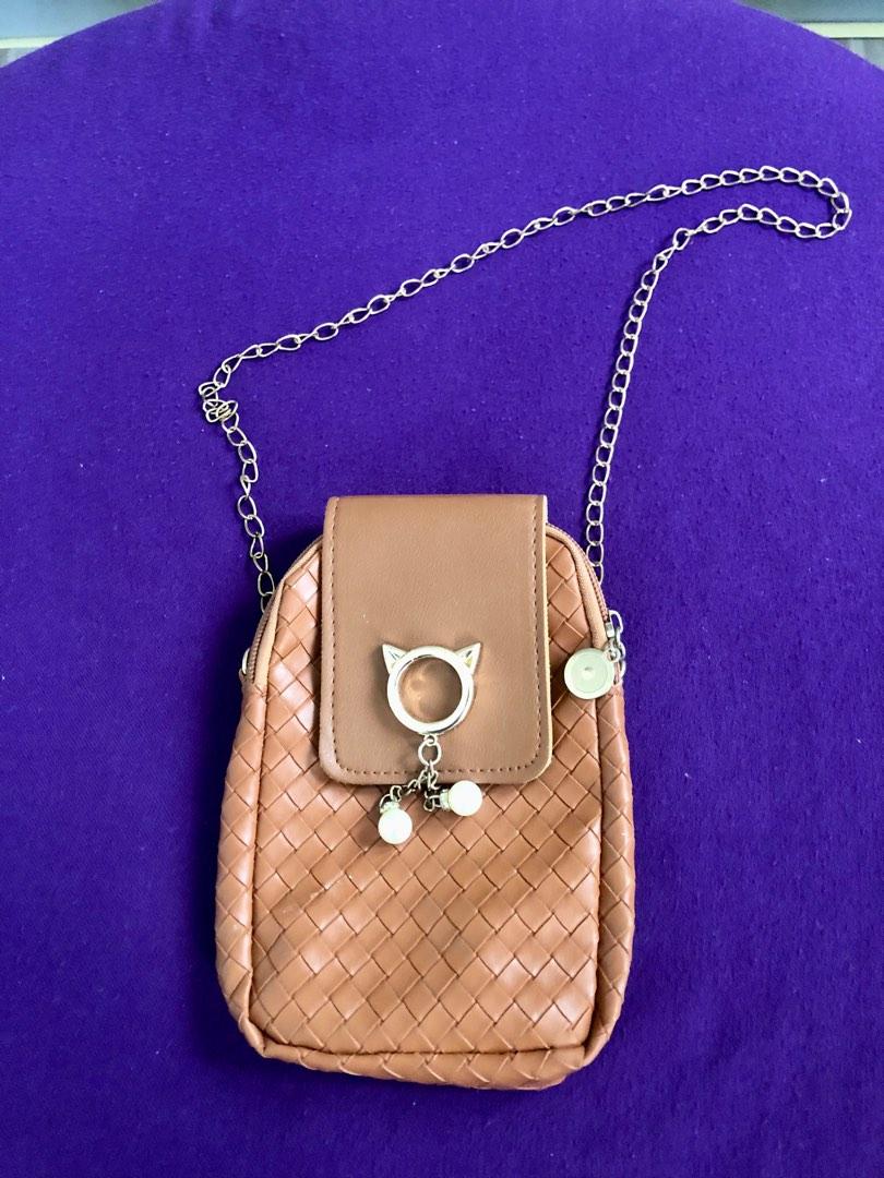 Cellphone sling bag (Category: Purses & Pouches) located in Muntinlupa City. Submitted by kayedelights (Listing ID 1189331147, Image 1). Description: 🧡 cat cute design 🧡 lightweight material.