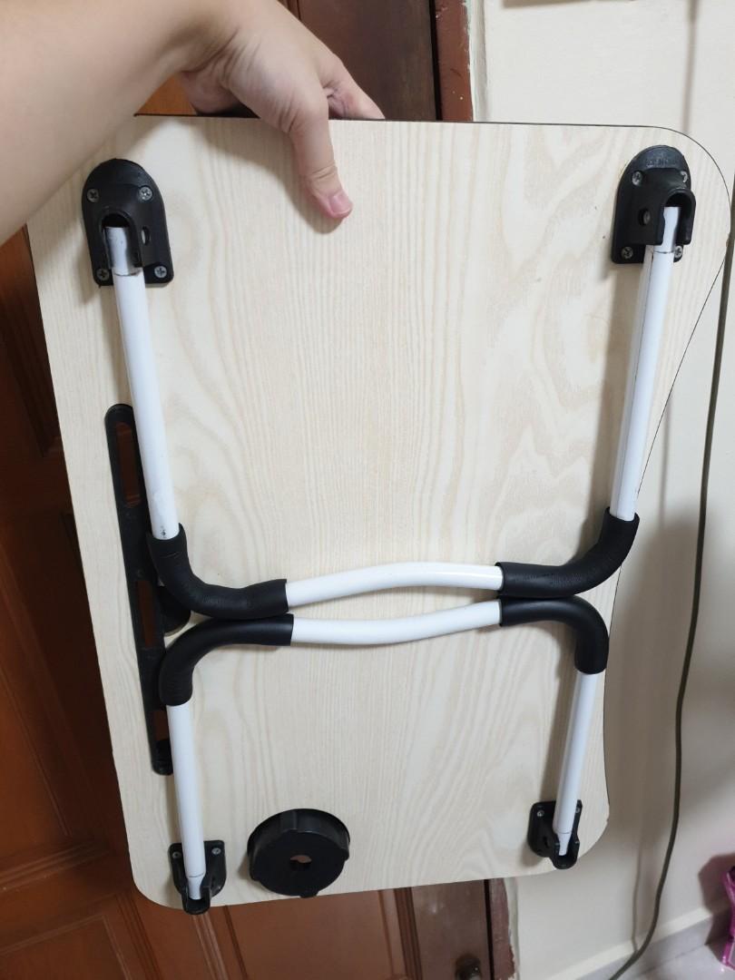 Foldable bed table (Category: Tables & Sets) located in Singapore. Submitted by crovetteofficial (Listing ID 1189629083, Image 2). Description: Foldable table complete with cup holder and ipad stand so that u can enjoy your Netflix and starbucks on your bed comfortably. Table legs have padding so it won't slip. very sturdy. 10/10 would recommend.