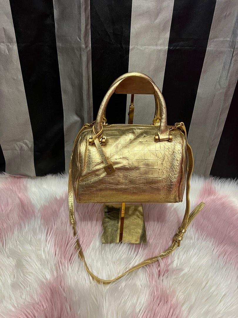 Defaye Black in gold leather with sling (Category: Luxury Bags & Wallets) located in Cebu City. Submitted by shofaholicz (Listing ID 1194075655, Image 1). Description: Very pretty in actual / rare gold color / amooth zipper and magnetic snap pocket.