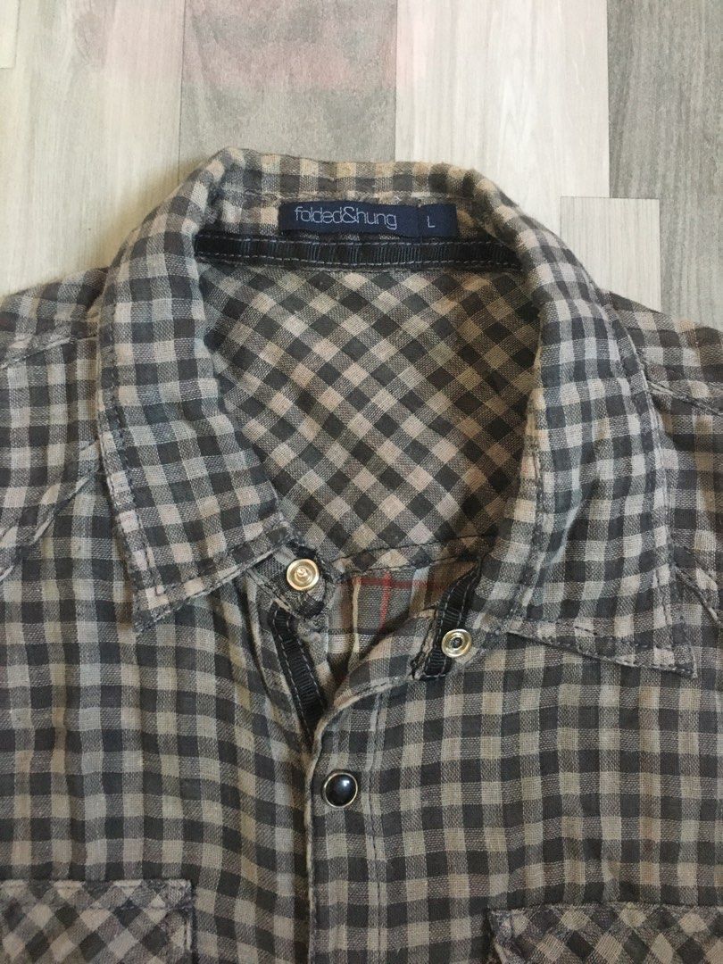 Folded and Hung checkered sleeveless polo (Category: Vests) located in Quezon City. Submitted by freeman520 (Listing ID 1195806833, Image 2). Description: Folded and Hung Sleeveless polo checkered Large size Used once only No damage or flaws Need wash only .