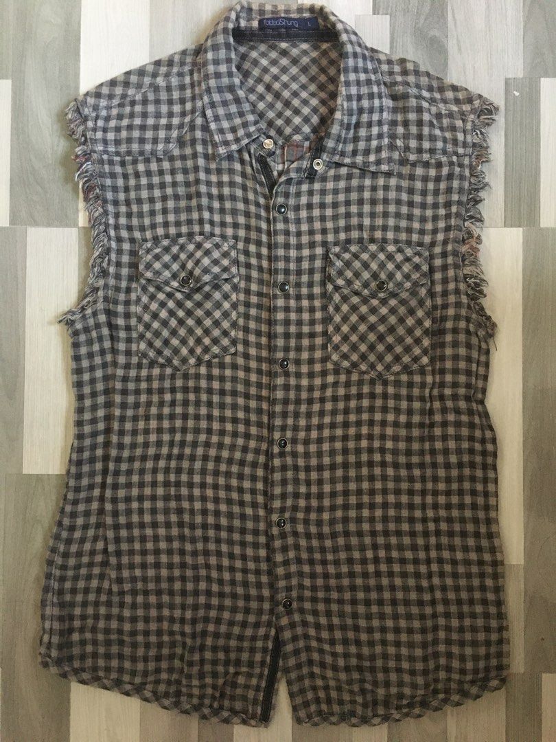 Folded and Hung checkered sleeveless polo (Category: Vests) located in Quezon City. Submitted by freeman520 (Listing ID 1195806833, Image 1). Description: Folded and Hung Sleeveless polo checkered Large size Used once only No damage or flaws Need wash only .
