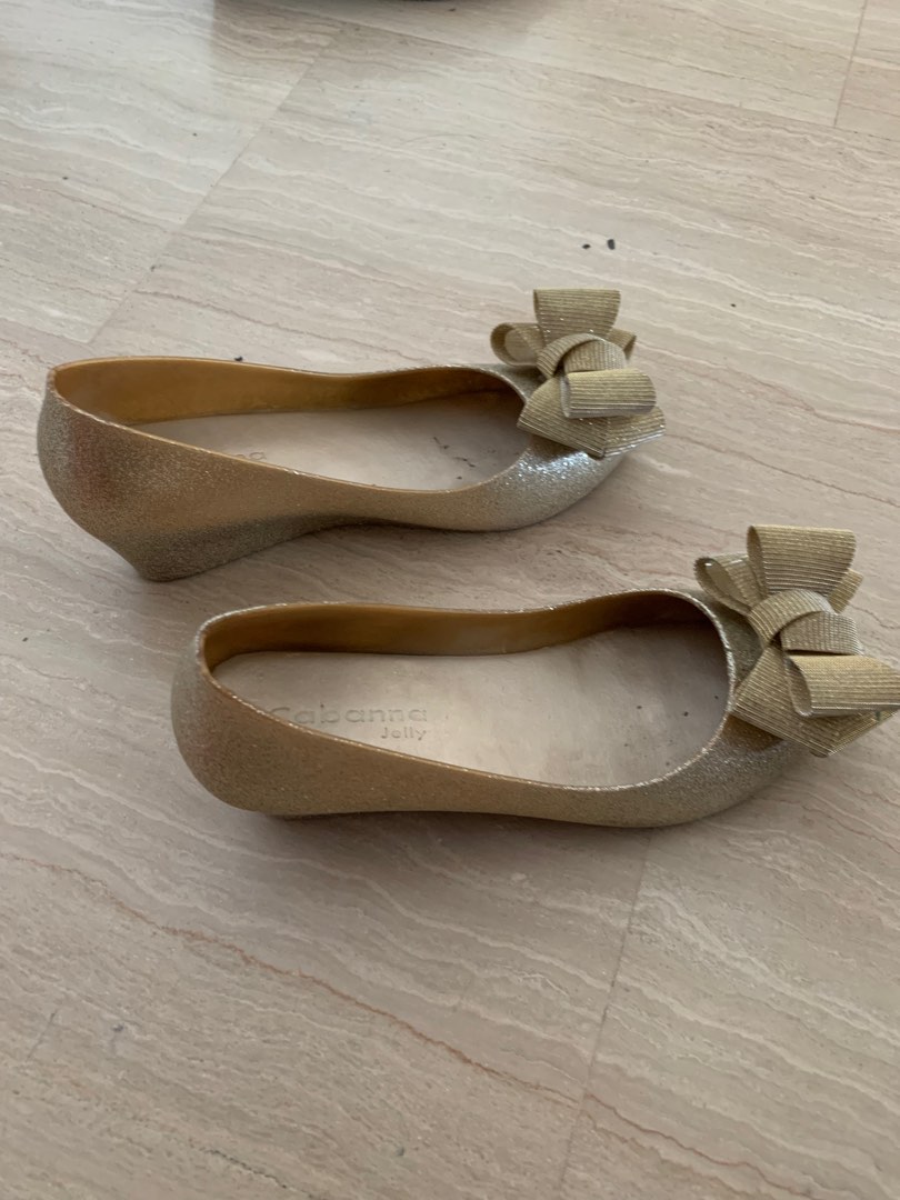 Lady s gold colour shoes