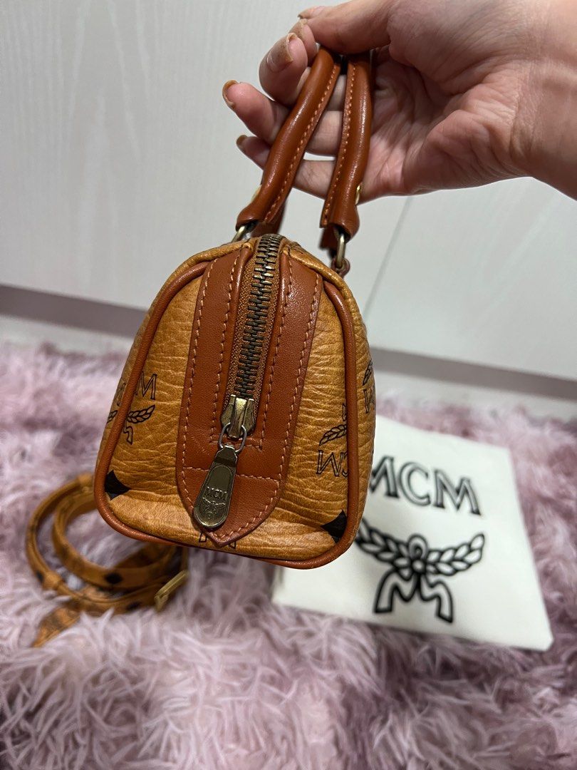 MCM Boston Nano (Category: Luxury Bags & Wallets) located in Quezon City. Submitted by hennessyscloset (Listing ID 1195807110, Image 3). Description: ❗️❗️LAST PRICE POSTED, DON’T CHAT IF YOU WILL ASK FOR A LAST PRICE ❗️❗️ Personal preloved MCM Nano, vintage condition, no flaws but with signs of usage. Please manage your expectations you’re buying a preloved item. No flaws unless it was stated here. Guaranteed authentic including the MCM sling(bou