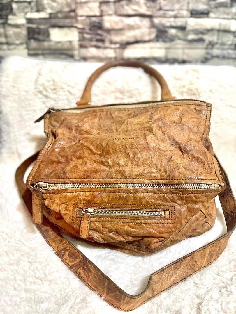 Authentic Givenchy Pandora Medium (Category: Luxury Bags & Wallets) located in Paranaque City. Submitted by sereneorganics (Listing ID 1196026641, Image 1). Description: 💯 Authentic Givenchy Pandora medium Color tan Overall condition of the bag is really nice but need a little cleaning (stocked) Pen marks inside Price is a bit negotiable No inclusions(bag only).