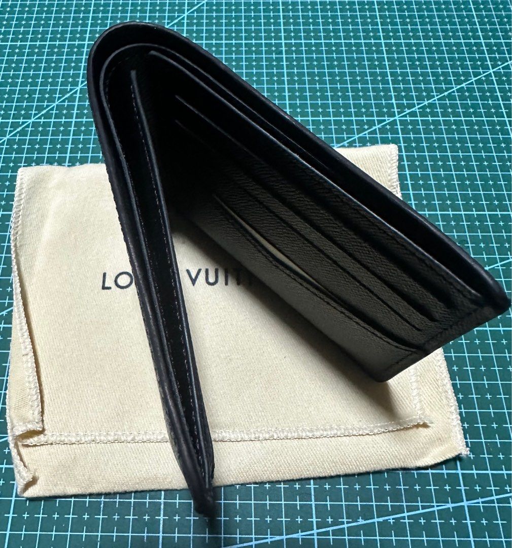 Shop Louis Vuitton TAIGA Slender wallet (M30539) by Materialgirl