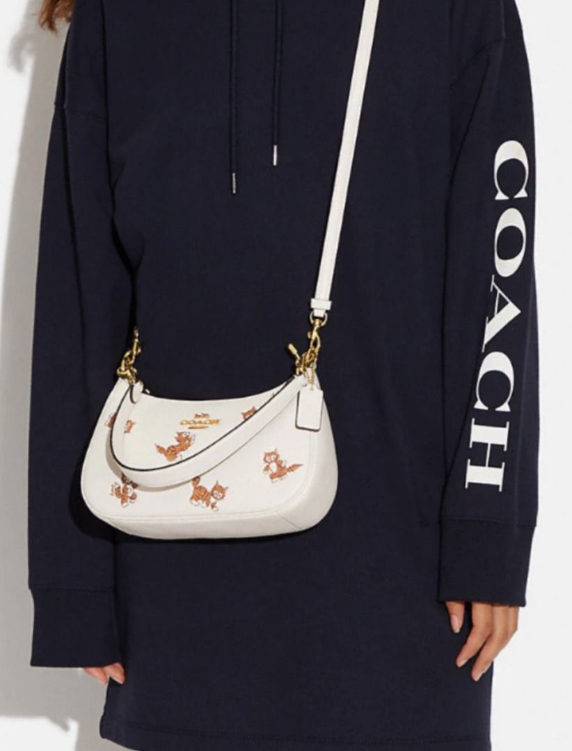 Coach cat bag sales