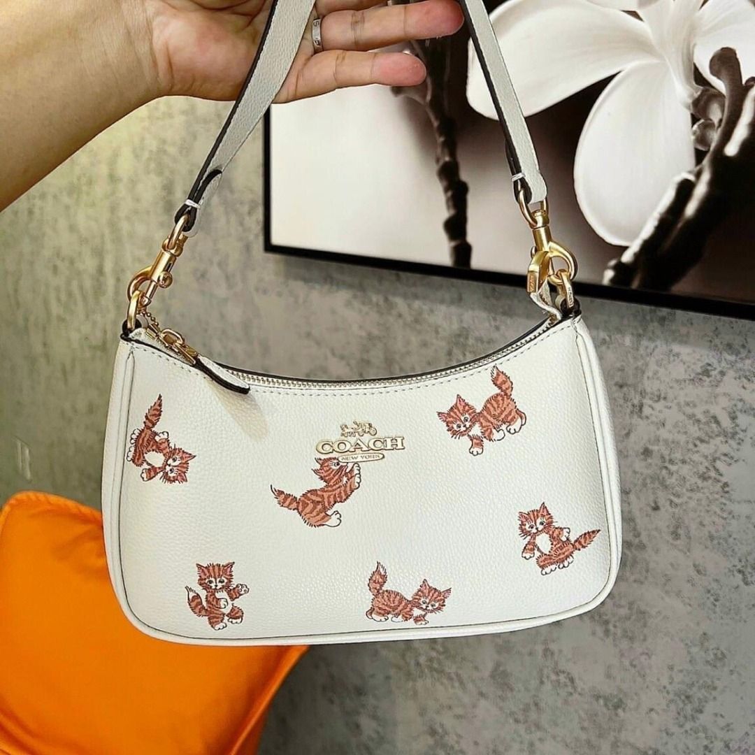 Coach cat bag sales