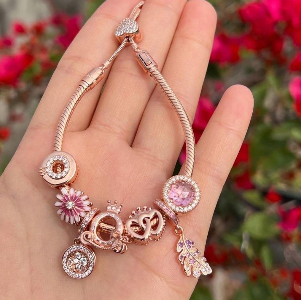 Pandora rosegold slider bracelet with set of 7 different rosegold charms Women s Fashion Jewelry Organizers Bracelets on Carousell