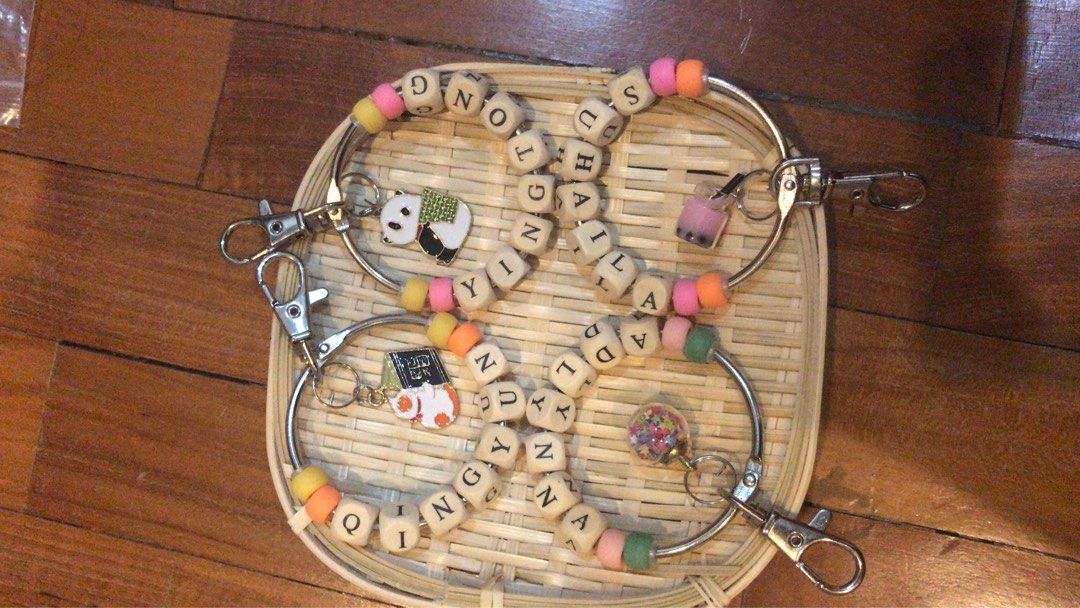 CUSTOMISED KEYCHAINS (Category: Babies & Kids Fashion) located in Singapore. Submitted by _choochoochain_ (Listing ID 1196324560, Image 2). Description: Kindly read the details below for the price list: Customised name keychain Standard ($1.80): up to 5 letters with 4 different beads. Standard+ ($2.00) up to 8 letters with 4 different beads. Additional $0.30 for wooden letters Add-on: 1 pastel acrylic bead: $0.20 Min orders more than 10 keychains
