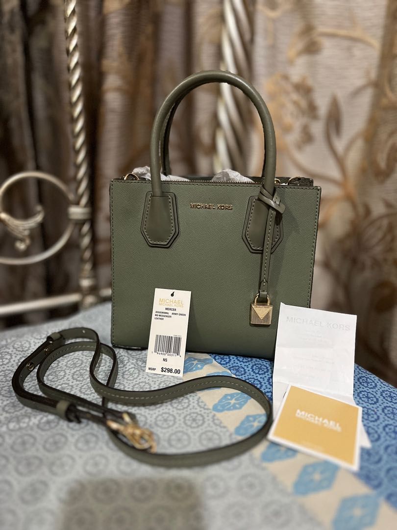 Michael Kors Mercer (Category: Luxury Bags & Wallets) located in Paranaque City. Submitted by vybash (Listing ID 1196314722, Image 2). Description: Selling this Preloved Michael Kors Mercer in Army green color Comes with Tag, Care Card and Gift Receipt. See photos for bag detail and flaw. .