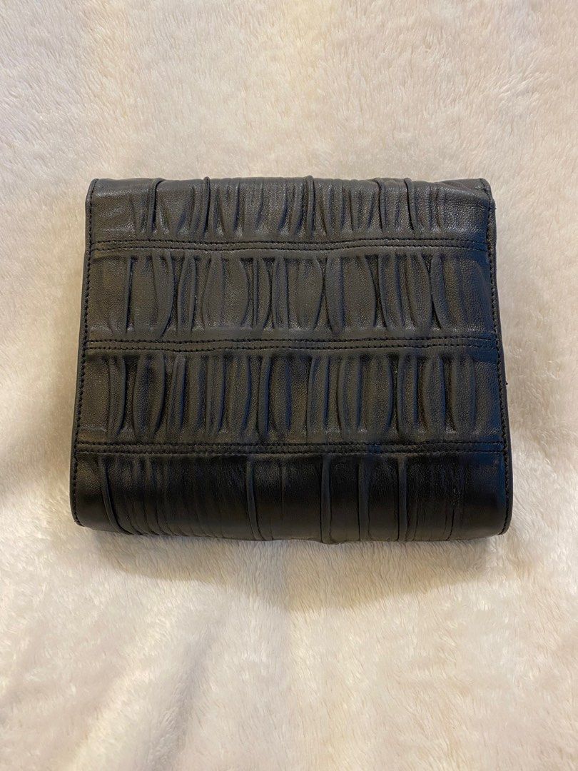 Authentic Vintage Prada Sling Bag (Category: Luxury Bags & Wallets) located in Quezon City. Submitted by ThriftCentralShop (Listing ID 1196429518, Image 3). Description: Purveyor of 100% ALL AUTHENTIC brand new, preloved and limited edition wallet, bags and shoes. 🔵Made in Italy 🔵With Entrupy (Certificate of Authenticity) 🔵With white tag 165 🔵Flaws on the gold hardware as signs of usage 🔵Issue on sling (not included) 🔵No inclusion 🔵 Please