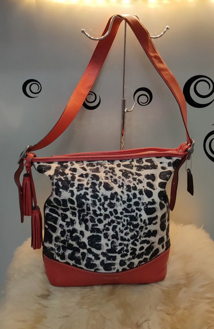 COACH Ocelot Print Leather/Cotton Satchel (Category: Luxury Bags & Wallets) located in Tuguegarao City. Submitted by roab_ (Listing ID 1196568263, Image 1). Description: 🔸 Preloved. 🔸 Authentic red ocelot print leather satchel. 🔸 Measures 13.5"L X 5"W X 12"H. 🔸This bag is in excellent condition. Payment: BDO Gcash Shipping: LBC Gogo Xpress.