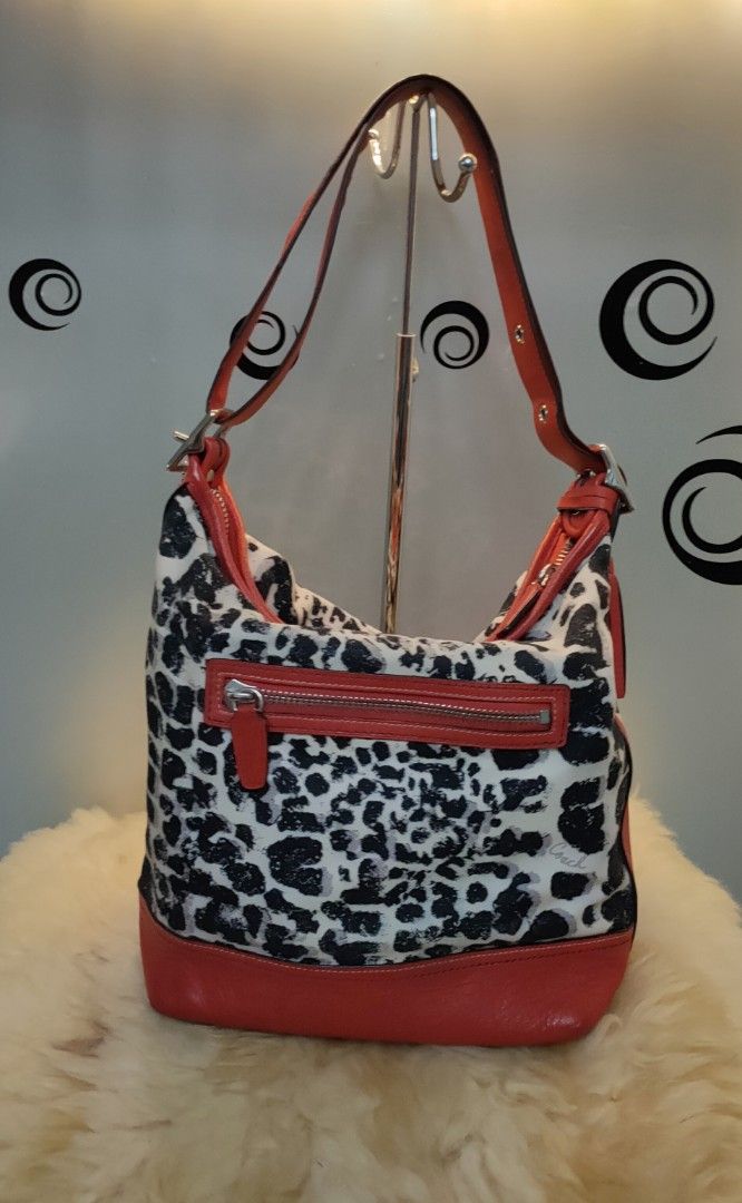 COACH Ocelot Print Leather/Cotton Satchel (Category: Luxury Bags & Wallets) located in Tuguegarao City. Submitted by roab_ (Listing ID 1196568263, Image 3). Description: 🔸 Preloved. 🔸 Authentic red ocelot print leather satchel. 🔸 Measures 13.5"L X 5"W X 12"H. 🔸This bag is in excellent condition. Payment: BDO Gcash Shipping: LBC Gogo Xpress.