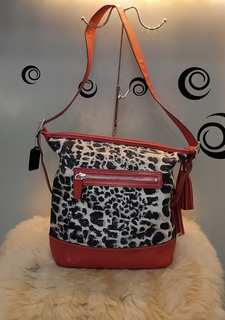 COACH Ocelot Print Leather/Cotton Satchel (Category: Luxury Bags & Wallets) located in Tuguegarao City. Submitted by roab_ (Listing ID 1196568263, Image 2). Description: 🔸 Preloved. 🔸 Authentic red ocelot print leather satchel. 🔸 Measures 13.5"L X 5"W X 12"H. 🔸This bag is in excellent condition. Payment: BDO Gcash Shipping: LBC Gogo Xpress.