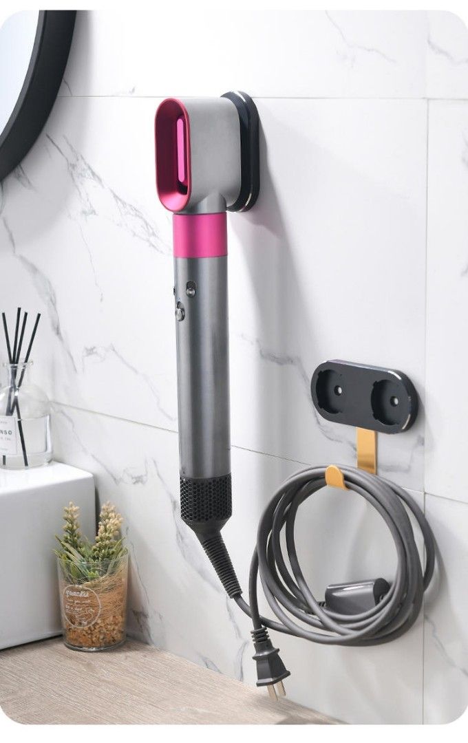 Dyson Airwrap Wall Mount (Category: Hair) located in Manila. Submitted by decluttermystuff21 (Listing ID 1196417564, Image 2). Description: 5-pc wall mount for Dyson Airwrap + attachments (actual set on first pic) Can be mounted via drilling or with cement glue Brand new, never used.