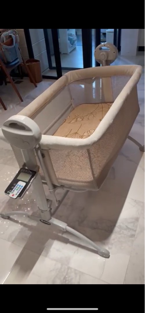 Electronic baby cot, Babies & Kids, Baby Nursery & Kids Furniture, Cots & Cribs on Carousell
