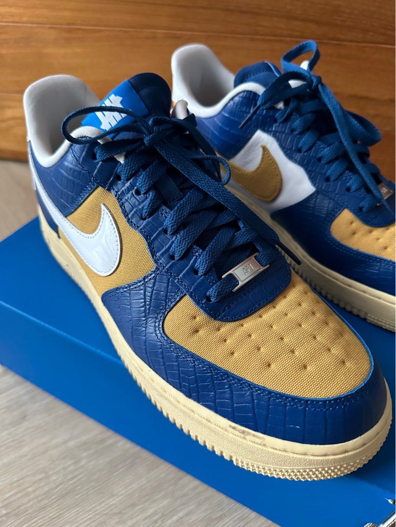 Nike undefeated sales gold