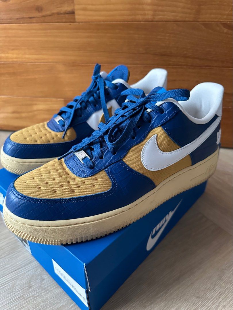 Nike undefeated sales gold