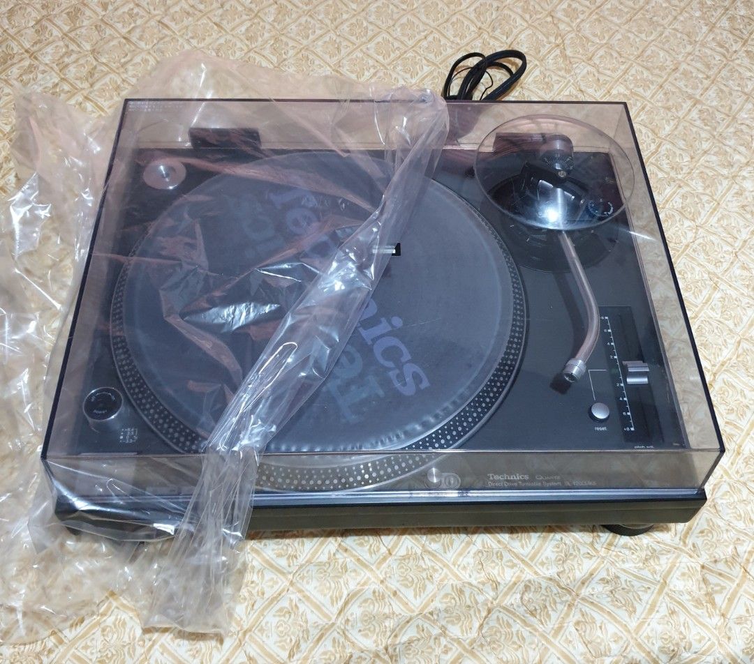 Technics SL-1200MK5 Turntable (Category: Soundbars, Speakers & Amplifiers) located in Manila. Submitted by racz03 (Listing ID 1196656765, Image 2). Description: Technics SL-1200MK5 Black Direct Drive Turntable. With Rubber Mat, Slipmat, Plastic Film Mat, 45rpm Adapter & Dust Cover. In Excellent Working Condition. The Body is in Nearmint Condition. Made in Japan Operating Power Voltage 100V.