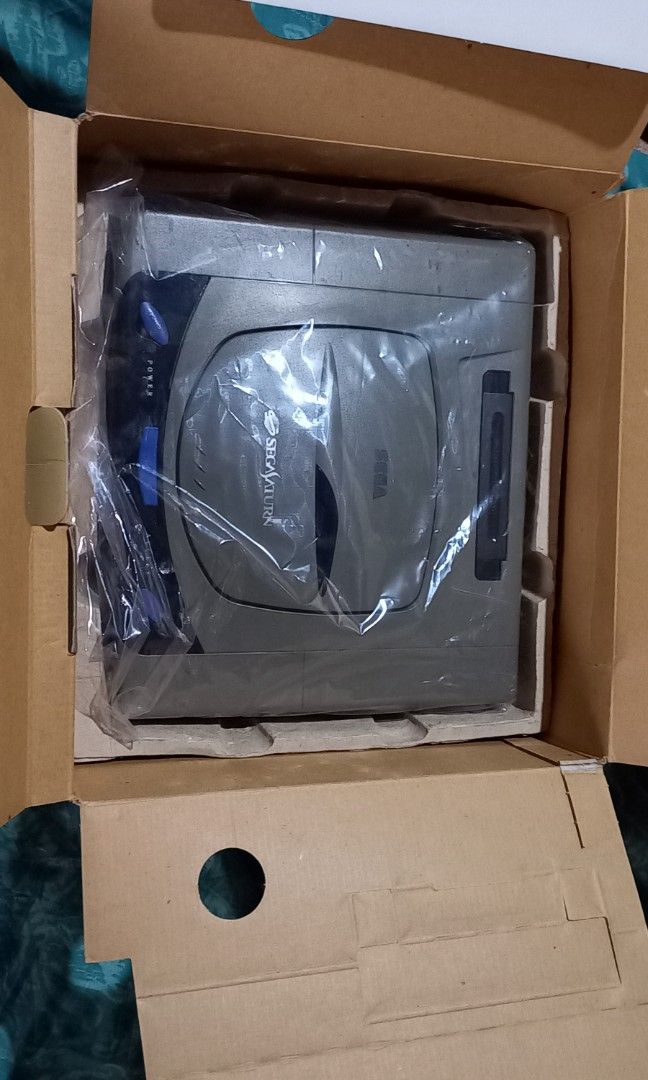 Sega Saturn (Category: Others) located in Impasugong. Submitted by sid_the_adorable (Listing ID 1196890427, Image 2). Description: Sega Saturn 1st Edition Japan Console 110 volts with box, manual in Jap., cables with 13 japanese games original cd saturn 2 controllers new cmus battery replacement very good condition console appearance slight yellow see pics nalang not modified bundle na lahat 5k txt me 09059380218.