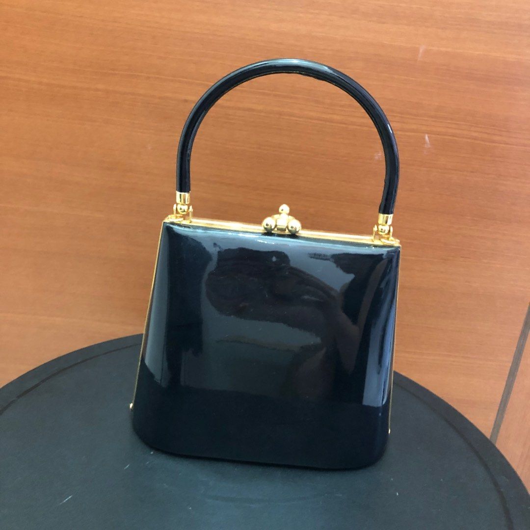 Designer black bucket bag deals