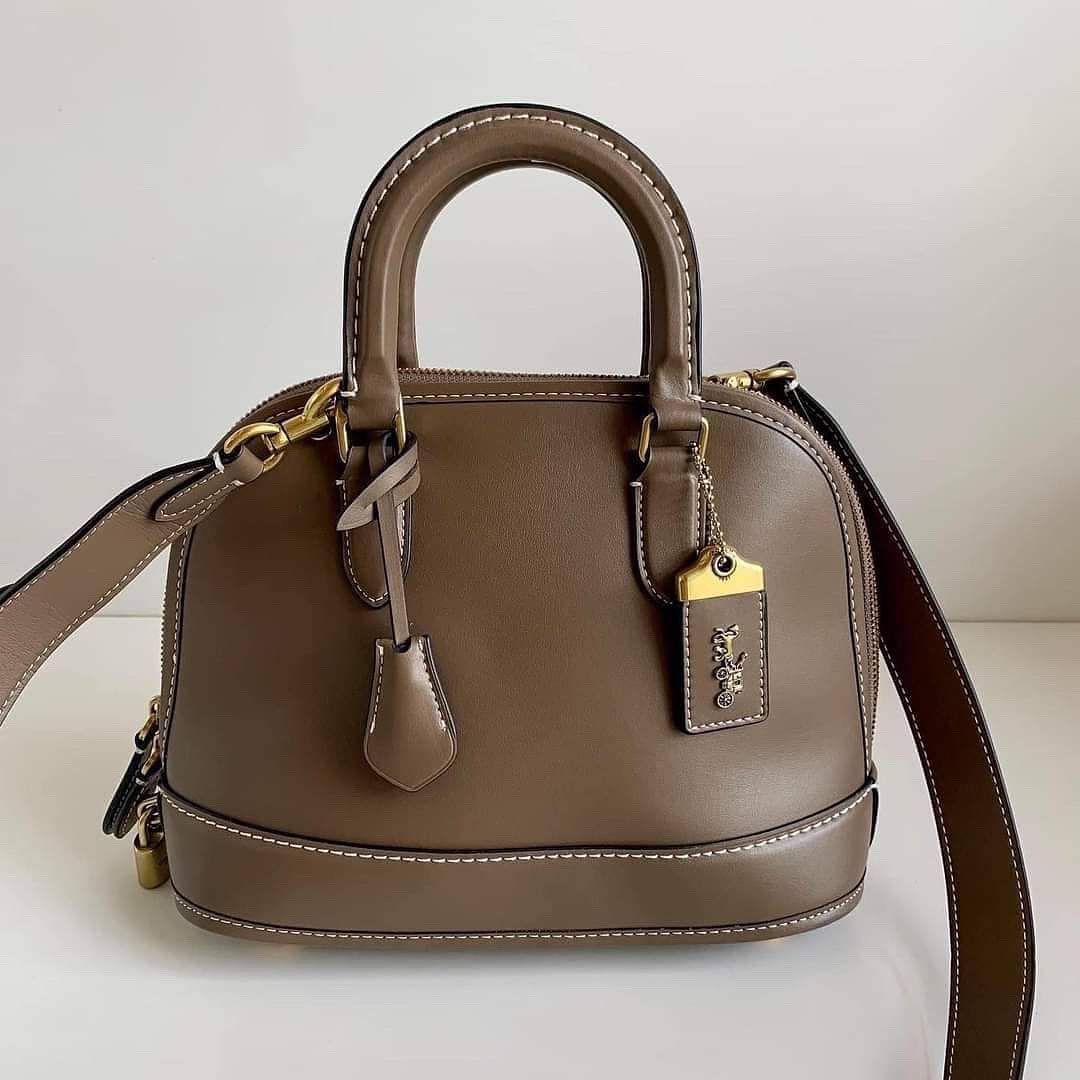 Coach Revel Bag in Dark stone (Category: Luxury Bags & Wallets) located in Cavite. Submitted by LuxbyMarifrance (Listing ID 1197317319, Image 1). Description: 🏷️ 3,000 only + SF 🛍️ Coach Revel Bag in Dark Stone 📏 10 1/4” (L) x 7 3/4” (H) x 4 3/4” (W) 📌 with tag, care card, dust bag, paper bag ✨All trademarks, logos and brand names are reserved and property of the original brand owners. #coachph #authenticqualitybagsph #authenticqualitybags #l