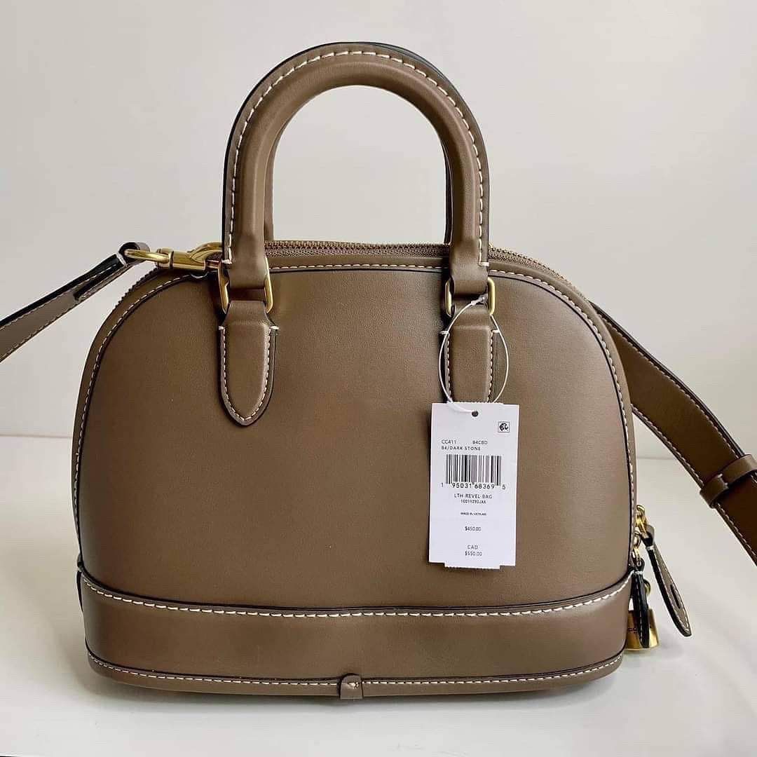 Coach Revel Bag in Dark stone (Category: Luxury Bags & Wallets) located in Cavite. Submitted by LuxbyMarifrance (Listing ID 1197317319, Image 2). Description: 🏷️ 3,000 only + SF 🛍️ Coach Revel Bag in Dark Stone 📏 10 1/4” (L) x 7 3/4” (H) x 4 3/4” (W) 📌 with tag, care card, dust bag, paper bag ✨All trademarks, logos and brand names are reserved and property of the original brand owners. #coachph #authenticqualitybagsph #authenticqualitybags #l