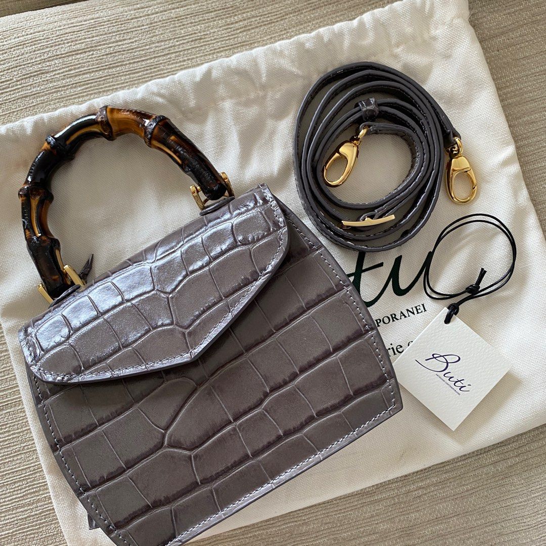 Italy Calfskin Bamboo Buti Minny Mini Cocco (Category: Bags & Wallets) located in Singapore. Submitted by toysmadness (Listing ID 1197356110, Image 1). Description: Handmade in Italy https://shop.butipelletterie.com calfskin bag with bamboo handle. Comes with a sling. Free shipping.
