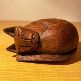 Wooden sleeping cat