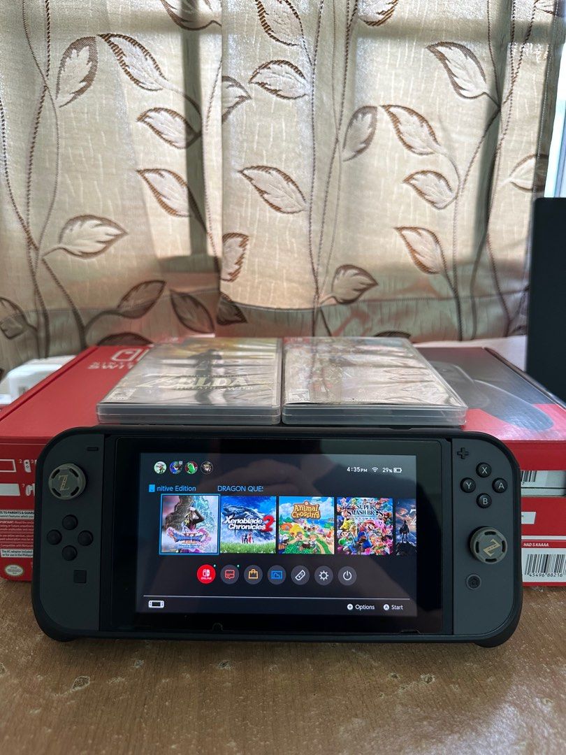 Selling Nintento Switch V2 with 7 Digital Games and 2 disc Video