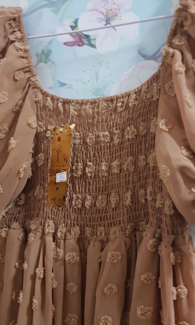 BKK Swiss Dots Dress (Category: Dresses) located in Quezon City. Submitted by anlimorevoni (Listing ID 1197888527, Image 3). Description: BKK Swiss Dots dress, brandnew, tan (color), fully- lined, puff sleeves, smocked at the back, best fits S, M, Semi-Large, gold tag. Measurements: Bust: Up to 34" Waist: Up to 30" Length: 35".