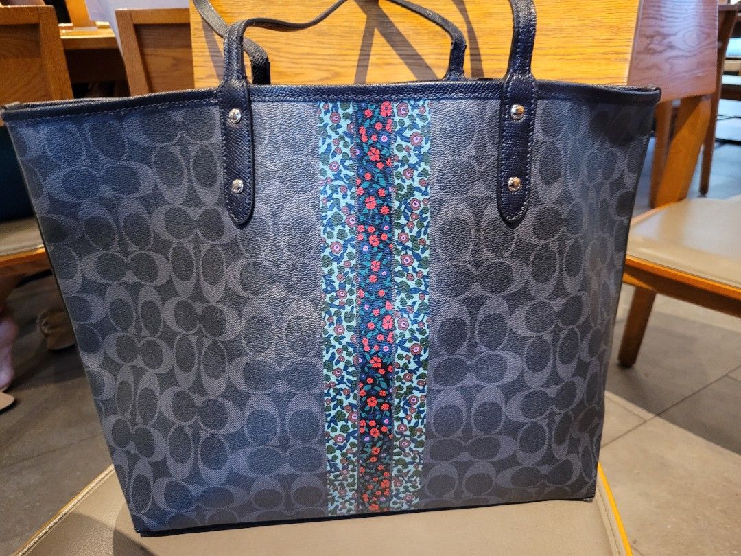 Coach reversible city shopper tote (Category: Purses & Pouches) located in Caloocan City. Submitted by starbucksph (Listing ID 1197883273, Image 3). Description: authentic COACH shopper tote pvc body leather handles signs of wear Add a pop of personality to your everyday ensembles with this chic tote featuring a vibrant star appliqué and ample space for all of your necessities. 18.5'' W x 11.5'' H x 6'' D 10'' shoulder drop Signature coated canva