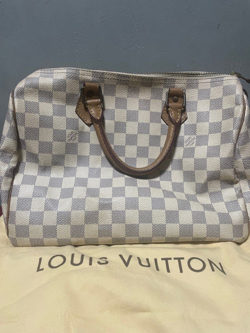 Louis Vuitton Speedy 30 Damier Azur (Category: Luxury Bags & Wallets) located in Manila. Submitted by queenbeea (Listing ID 1197887108, Image 1). Description: 100% Authentic. with ballpen ink stains at the bottom (please see other pictures for reference) with padlock,still looking for the keys. with dustbag negotiable .