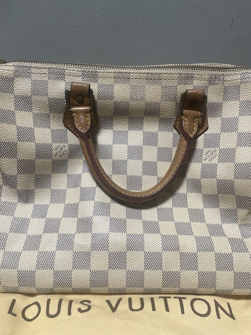 Louis Vuitton Speedy 30 Damier Azur (Category: Luxury Bags & Wallets) located in Manila. Submitted by queenbeea (Listing ID 1197887108, Image 2). Description: 100% Authentic. with ballpen ink stains at the bottom (please see other pictures for reference) with padlock,still looking for the keys. with dustbag negotiable .