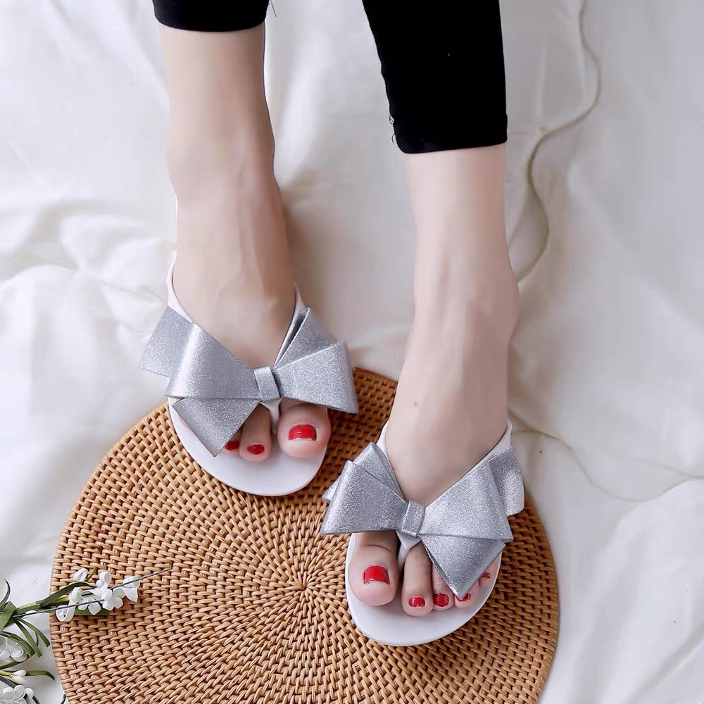 Melissa bow best sale flip flops