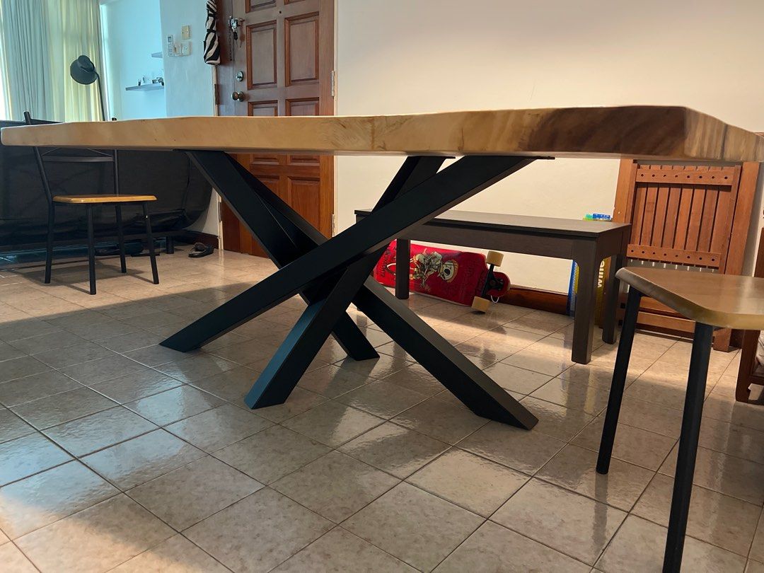 Solid Wood Dining Table (Category: Tables & Sets) located in Singapore. Submitted by atomic38 (Listing ID 1197823027, Image 2). Description: Solid Suar wood dining table. Good condition. Moving and need to downsize. 206x100-105x74cm.