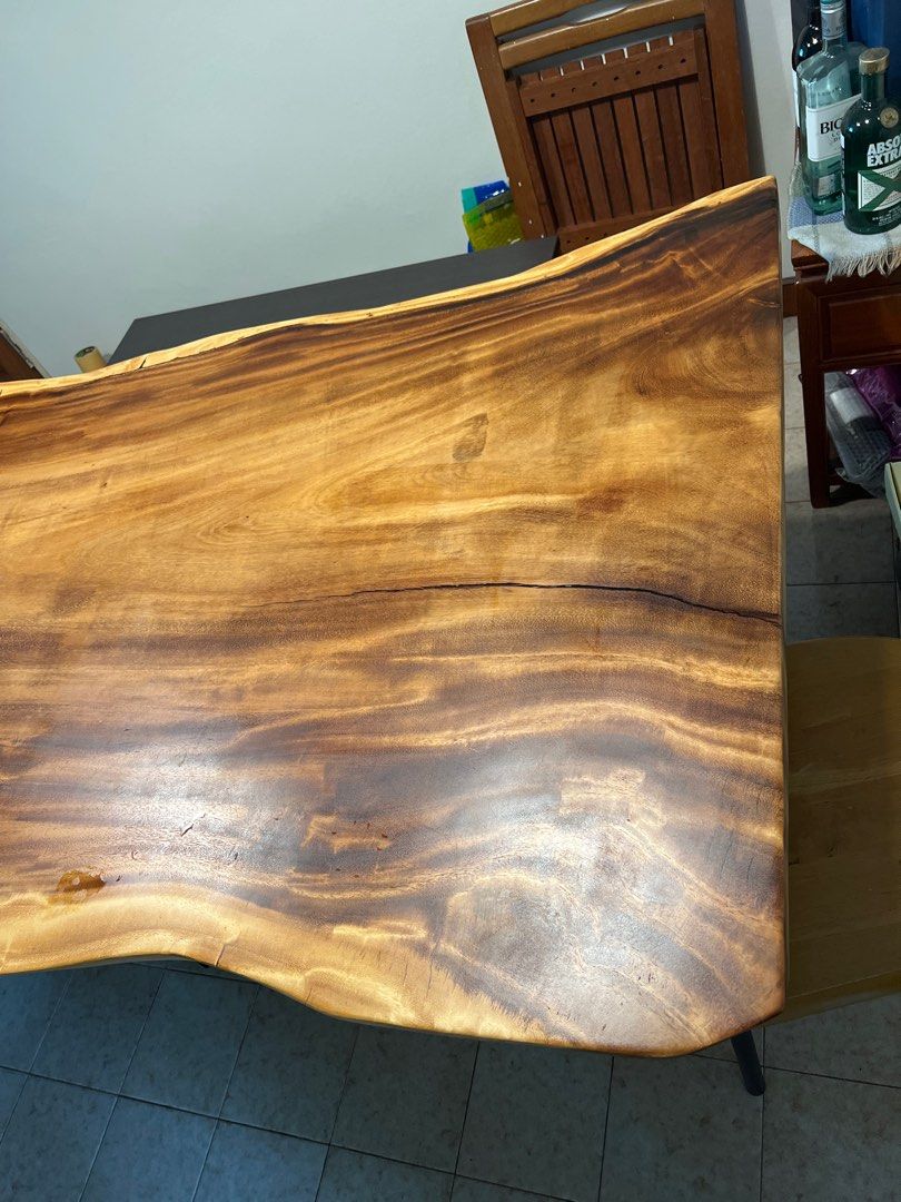 Solid Wood Dining Table (Category: Tables & Sets) located in Singapore. Submitted by atomic38 (Listing ID 1197823027, Image 3). Description: Solid Suar wood dining table. Good condition. Moving and need to downsize. 206x100-105x74cm.
