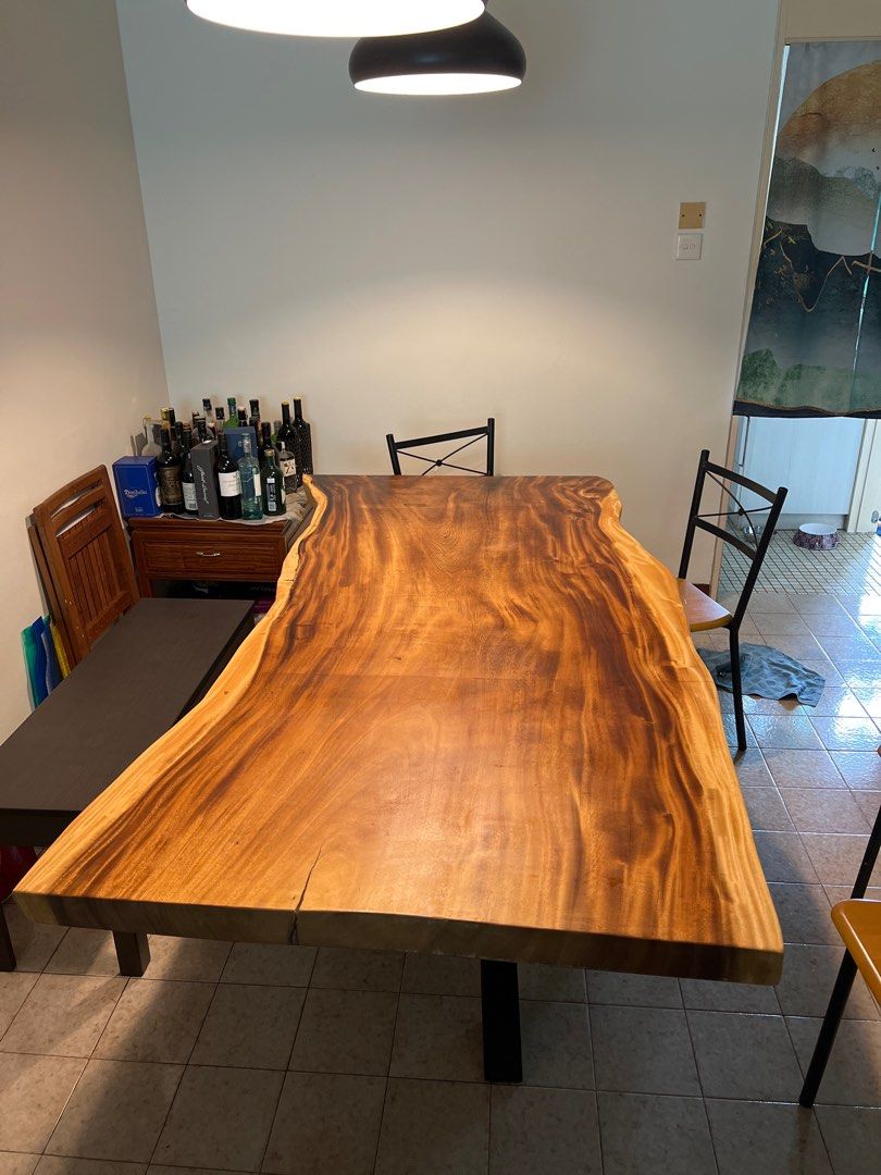 Solid Wood Dining Table (Category: Tables & Sets) located in Singapore. Submitted by atomic38 (Listing ID 1197823027, Image 1). Description: Solid Suar wood dining table. Good condition. Moving and need to downsize. 206x100-105x74cm.