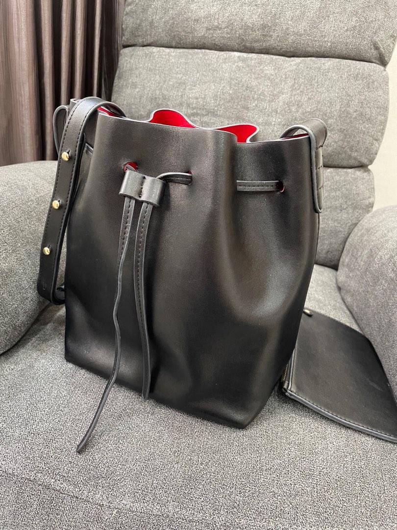Black bucket bag clearance with red lining