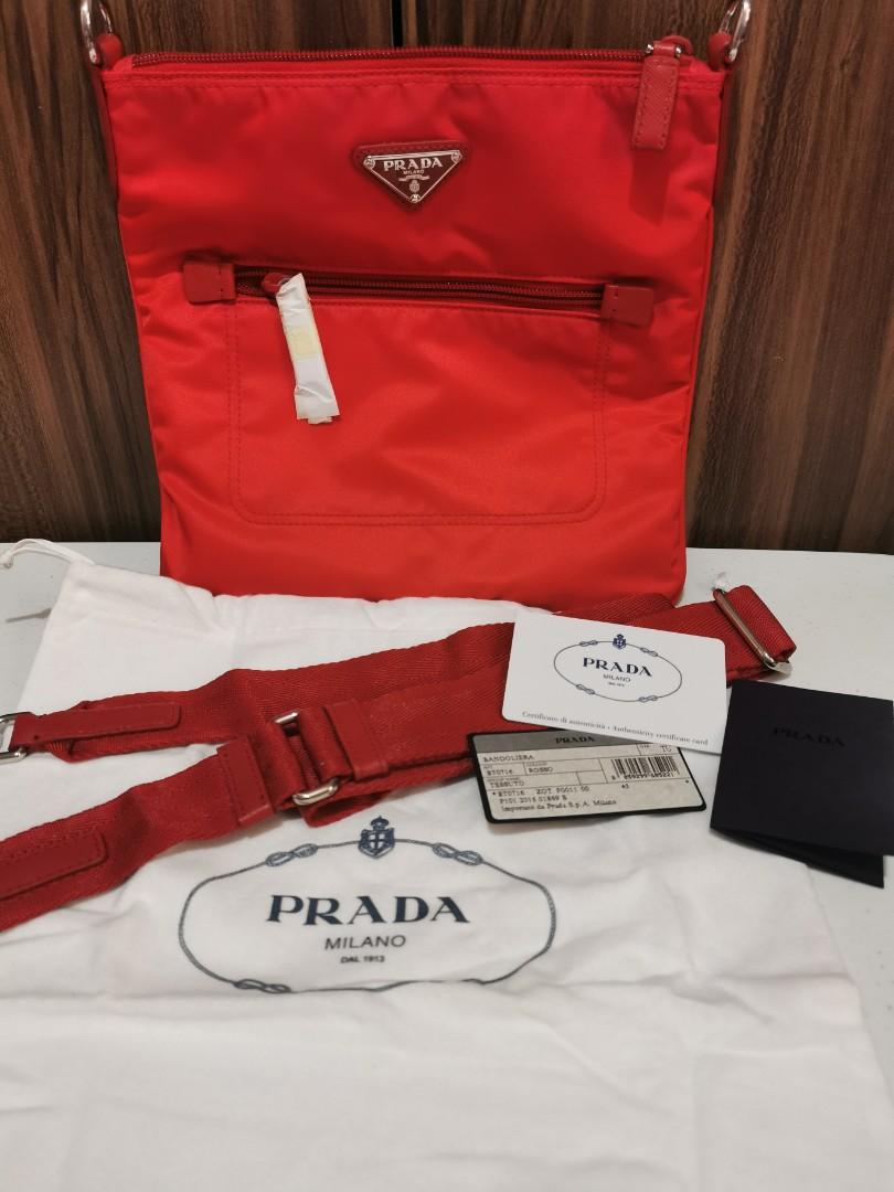 NEW: PRADA Tessuto Sling Bag ( Rosso ) (Category: Luxury Bags & Wallets) located in Marikina City. Submitted by yourlittleshop25 (Listing ID 1194218845, Image 1). Description: NEW: PRADA Tessuto Sling Bag ( Rosso) - Tessuto nylon body - Saffiano leather details - silver hardware - adjustable strap - with authenticity card and dust bag - condition: 10/10.