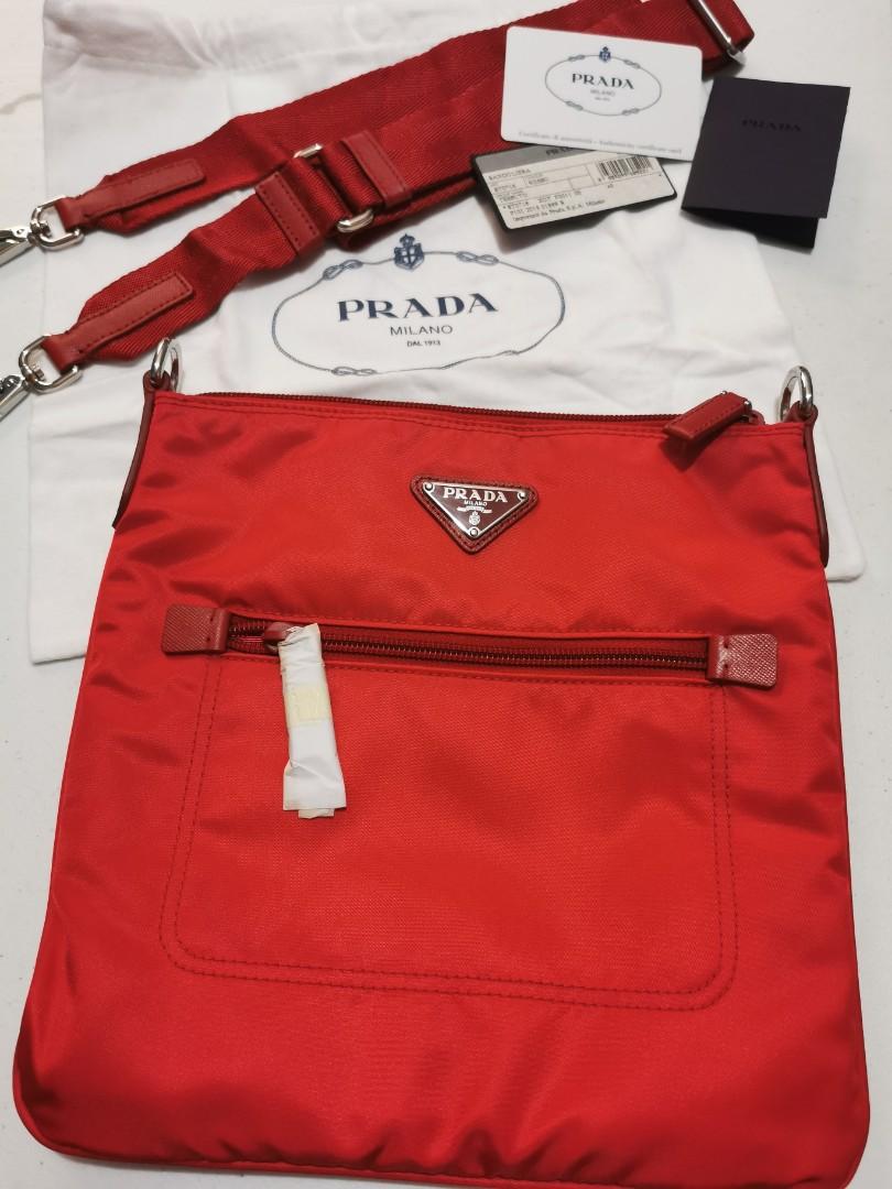 NEW: PRADA Tessuto Sling Bag ( Rosso ) (Category: Luxury Bags & Wallets) located in Marikina City. Submitted by yourlittleshop25 (Listing ID 1194218845, Image 2). Description: NEW: PRADA Tessuto Sling Bag ( Rosso) - Tessuto nylon body - Saffiano leather details - silver hardware - adjustable strap - with authenticity card and dust bag - condition: 10/10.