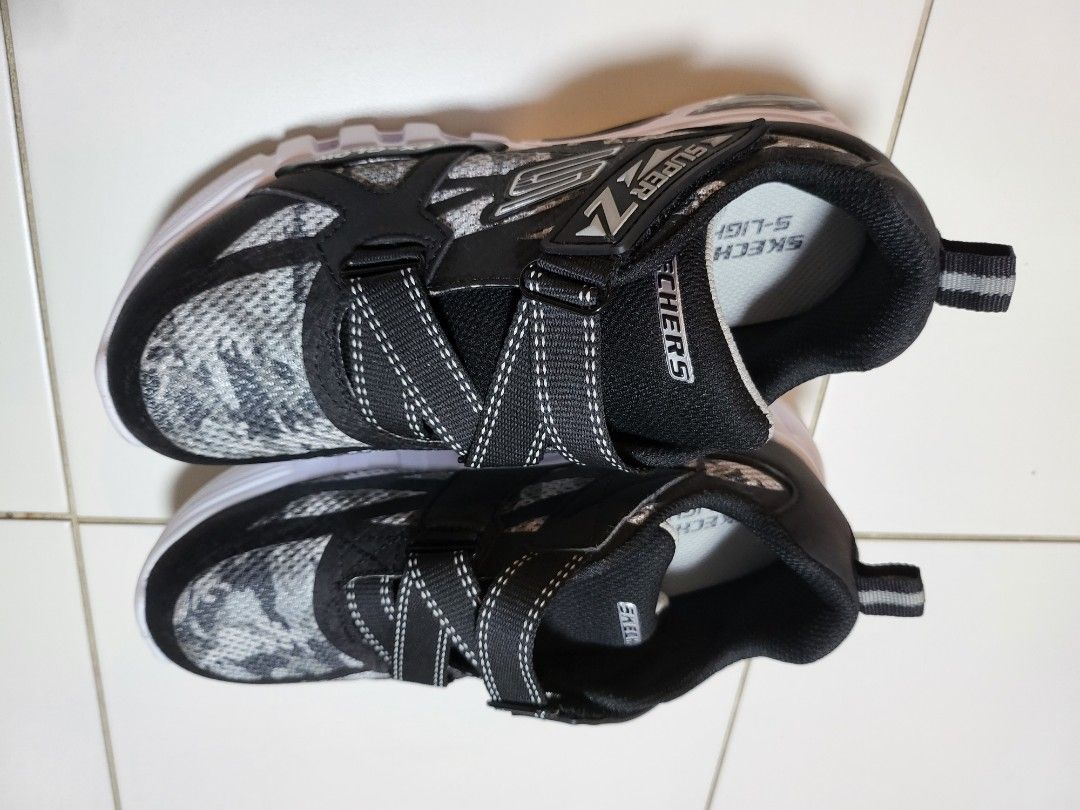 Boys skechers black white neon light series size 5 Babies Kids Babies Kids Fashion on Carousell