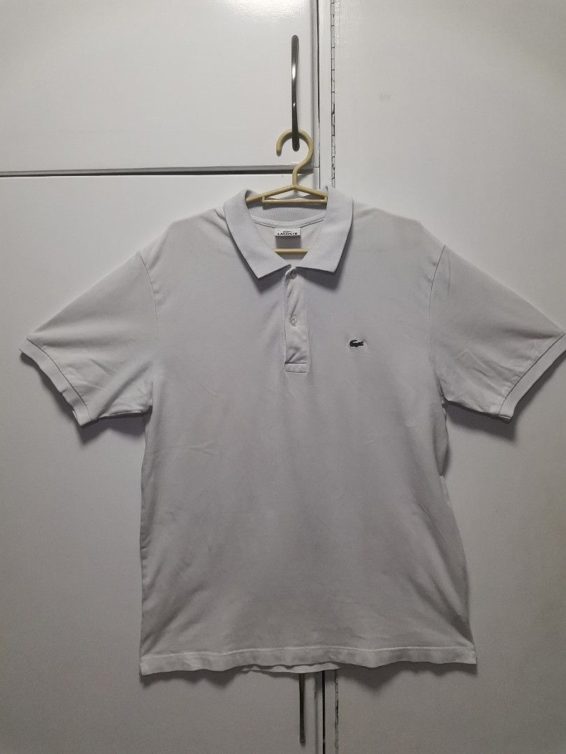 Lacoste White Polo Shirt (Category: Tshirts & Polo Shirts ) located in San Jose. Submitted by dos__ (Listing ID 1198153807, Image 2). Description: Lacoste White Polo Shirt Excellent Condition Color rate: 9/10 Dimensions: 22W x 29L Size 6 on tag No issue Dm for more detailed pics.