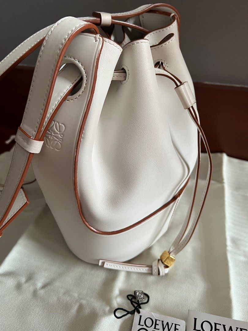 LOEWE Balloon bucket bag small (Category: Luxury Bags & Wallets) located in Muntinlupa City. Submitted by bagstagram (Listing ID 1198274749, Image 1). Description: DESCRIPTION : Balloon small bag. MATERIAL : 100% calfskin COLOR : soft white ITEM MEASUREMENTS : Height 25 cm / 9.8 “, Width 18 cm / 7.1 “, Depth 13.5 cm / 5.3 “. COUNTRY OF MANUFACTURE : Spain RFS decluttering Complete inclusions .
