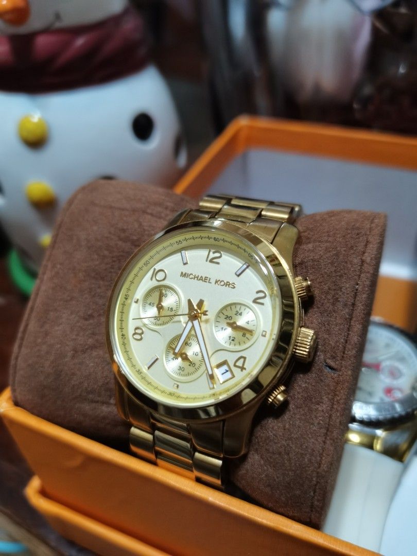 MK RUNWAY GOLD TONE WATCH (Category: Women's Watches) located in Manila. Submitted by fluer_de_lis (Listing ID 1198404717, Image 2). Description: Legit MK RUNWAY in goldtone. Personal use. Well taken care of. Pls scan barcode for product details.