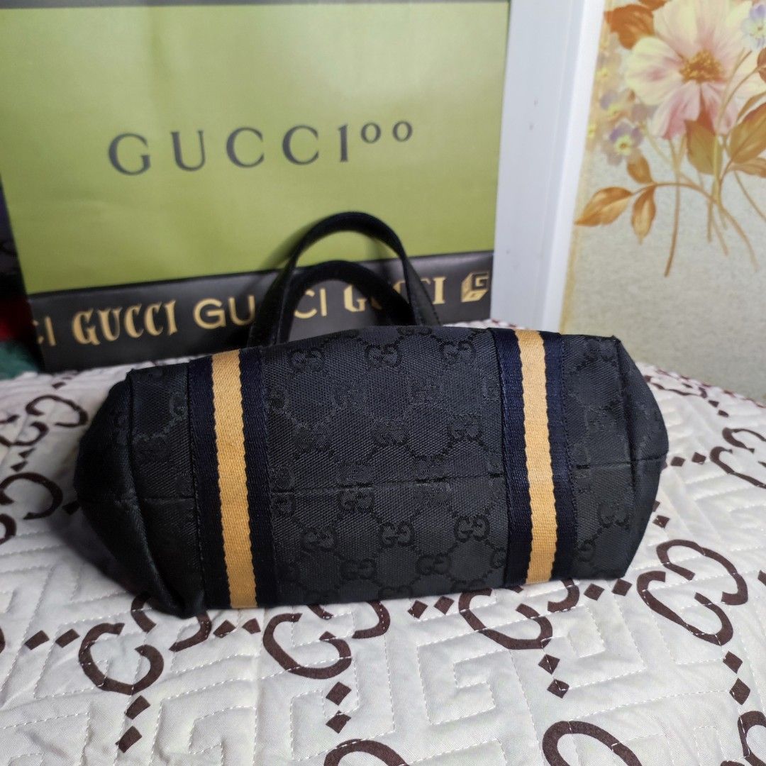 🇯🇵GG Mini Tote (Category: Luxury Bags & Wallets) located in Santa Rosa. Submitted by yerbua103 (Listing ID 1198658779, Image 3). Description: 👛This a classic Gucci's monogram with its black exterior canvas and leather handles. this bag features dual handles and gold toned hardwares, 2 charms from one of the handles - a classic Gucci Horsebit Bag and a classic Gucci boot accentuates the bag. Interior is a black lining with a zip pocket and a sl