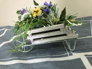 Wooden crate with artificial flowers