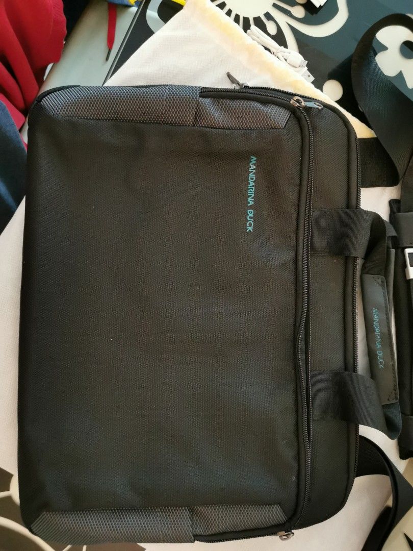 Paid S 172 when new. Used once only. Mandarin Duck laptop bag branded authentic. Good as new