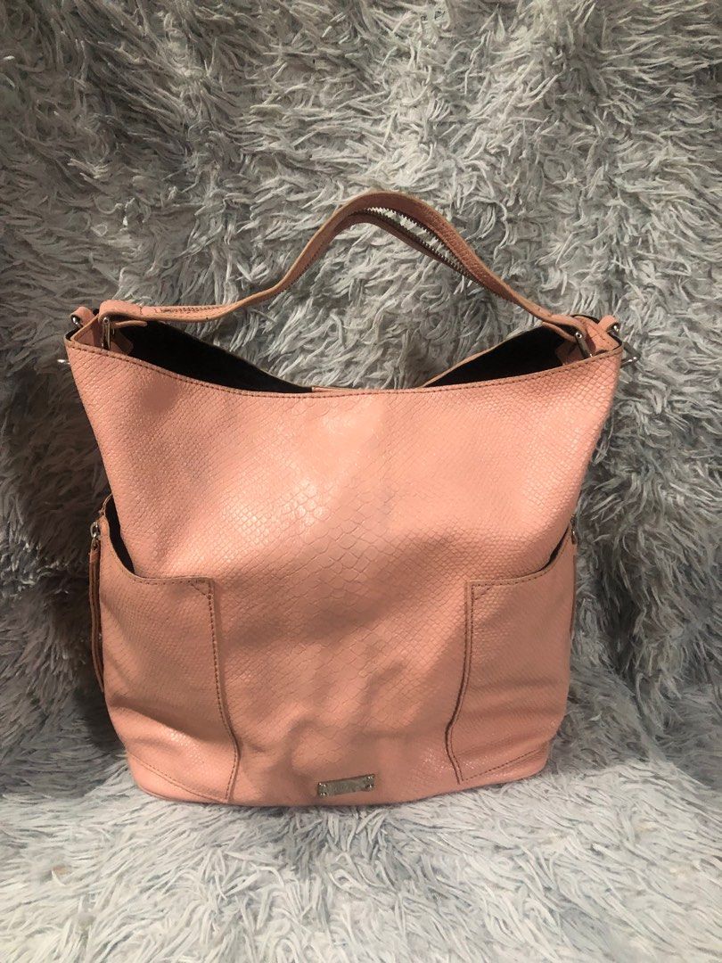 Original Breal big hobo bag (Category: Luxury Bags & Wallets) located in Angono. Submitted by fhlor02 (Listing ID 1199193319, Image 1). Description: Original Breal big hobo bag, no rubs on d edges and on d handle, unused condition, flaw: missing zipper head on d handle, 12”by16”by6”.